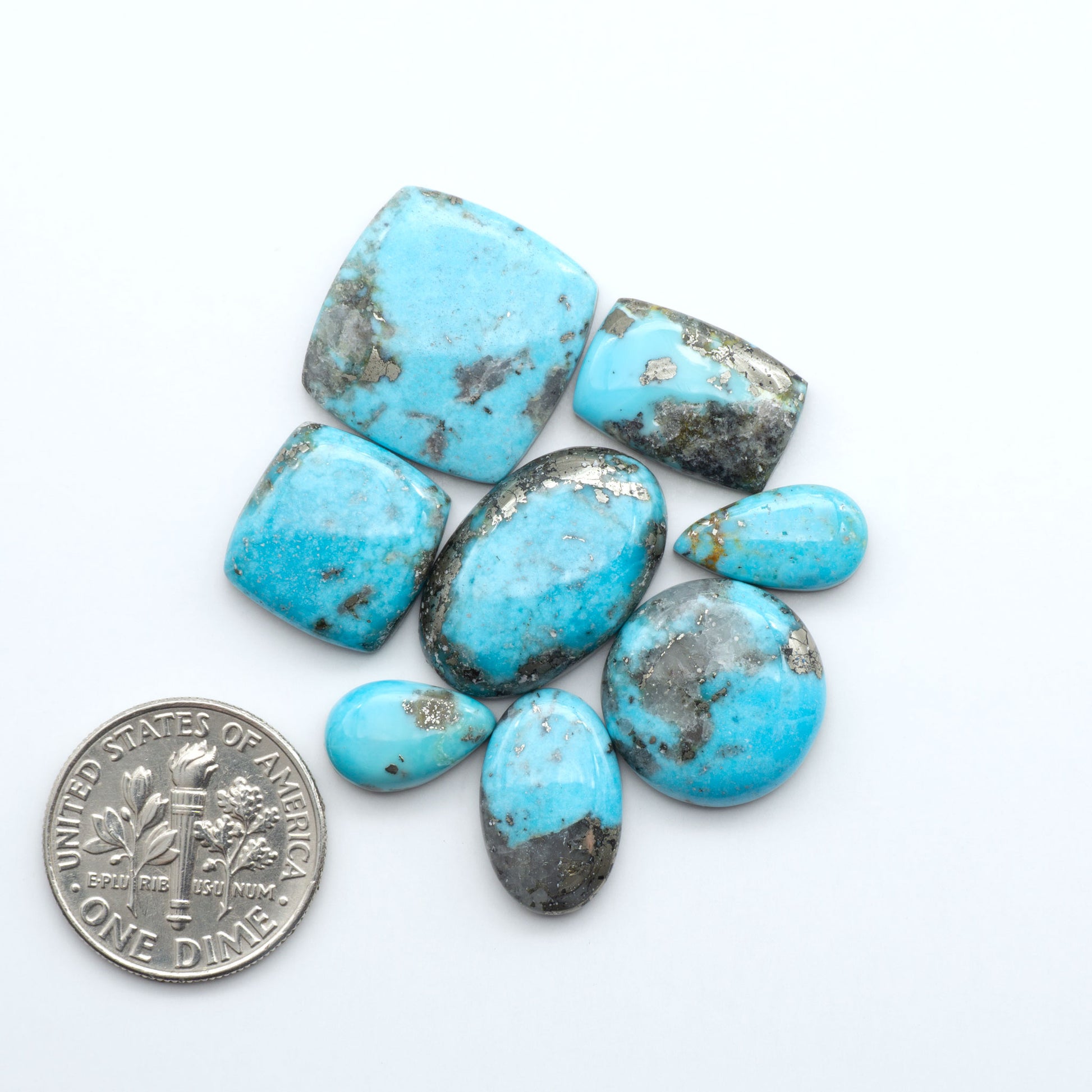 Nacozari turquoise cabochons are striking gemstones known for their vibrant blue to greenish-blue colors and pyrite, these stones are prized in jewelry making.