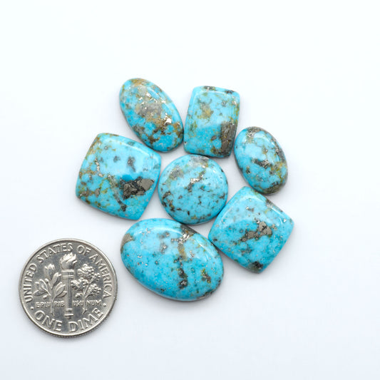 Nacozari turquoise cabochons are striking gemstones known for their vibrant blue to greenish-blue colors and pyrite, these stones are prized in jewelry making.