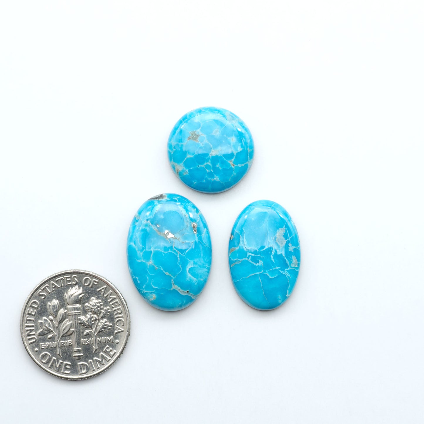 Sierra Bella Turquoise cabochons feature rich blue-green color and natural matrix variation. Ideal for silversmiths, jewelers, and custom jewelry designs.