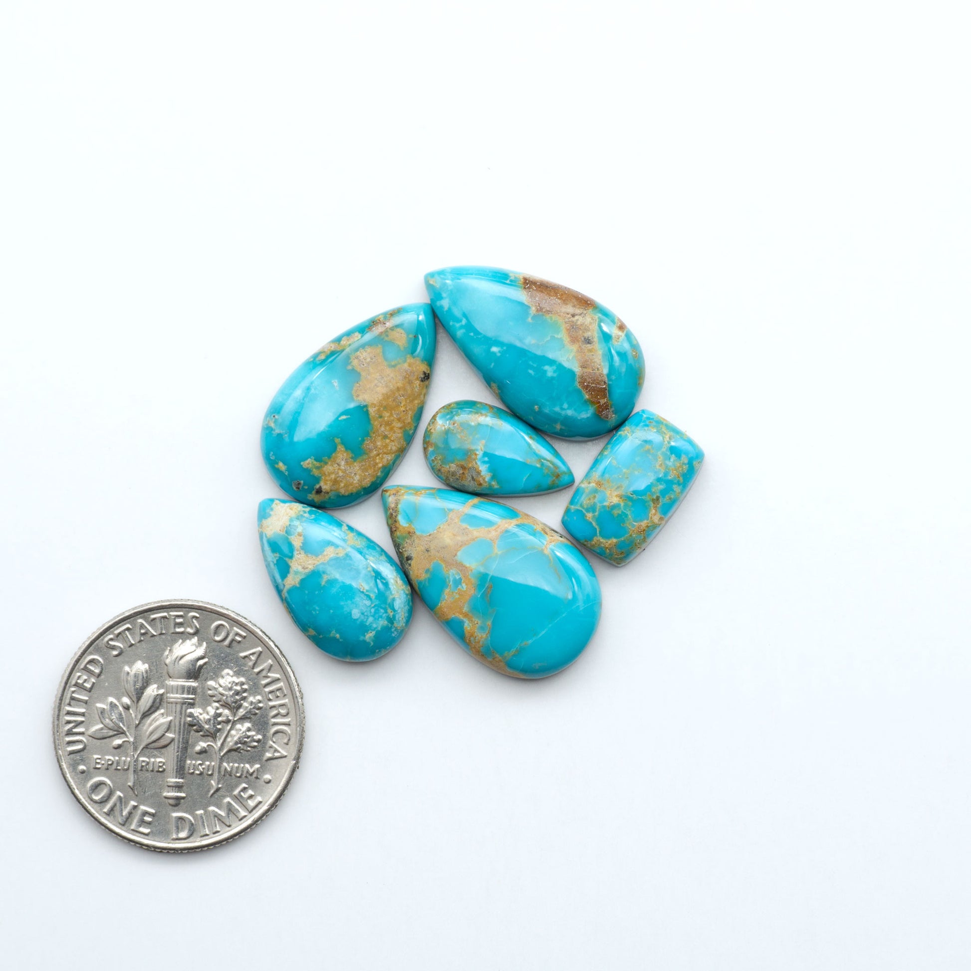Sierra Bella Turquoise cabochons feature rich blue-green color and natural matrix variation. Ideal for silversmiths, jewelers, and custom jewelry designs.