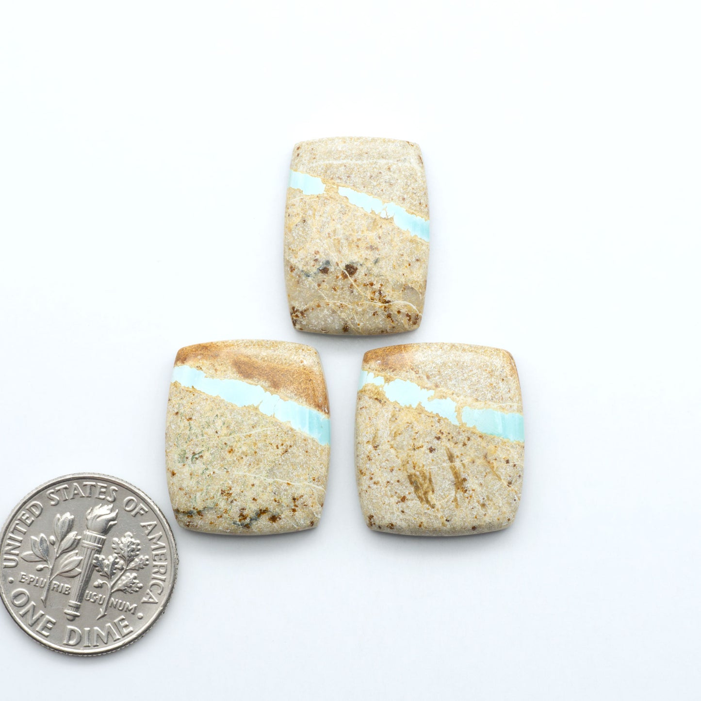 Royston Turquoise cabochons are famous for their distinctive matrix and unique green and blue hues, making them a favored option among jewelry designers.