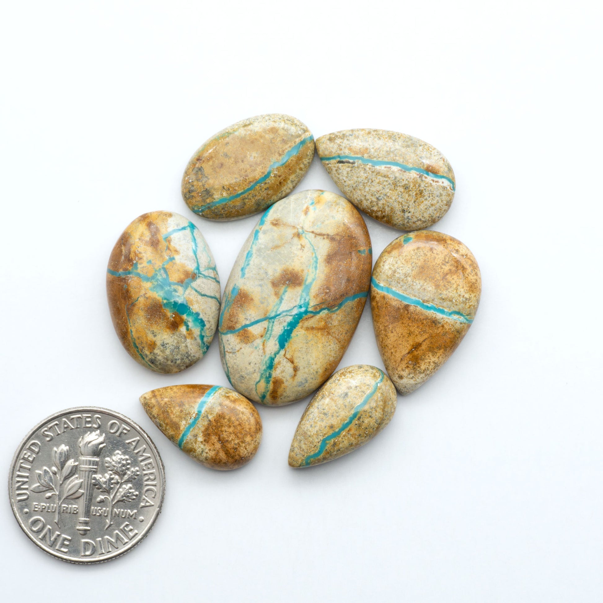 Royston Turquoise cabochons are famous for their distinctive matrix and unique green and blue hues, making them a favored option among jewelry designers.