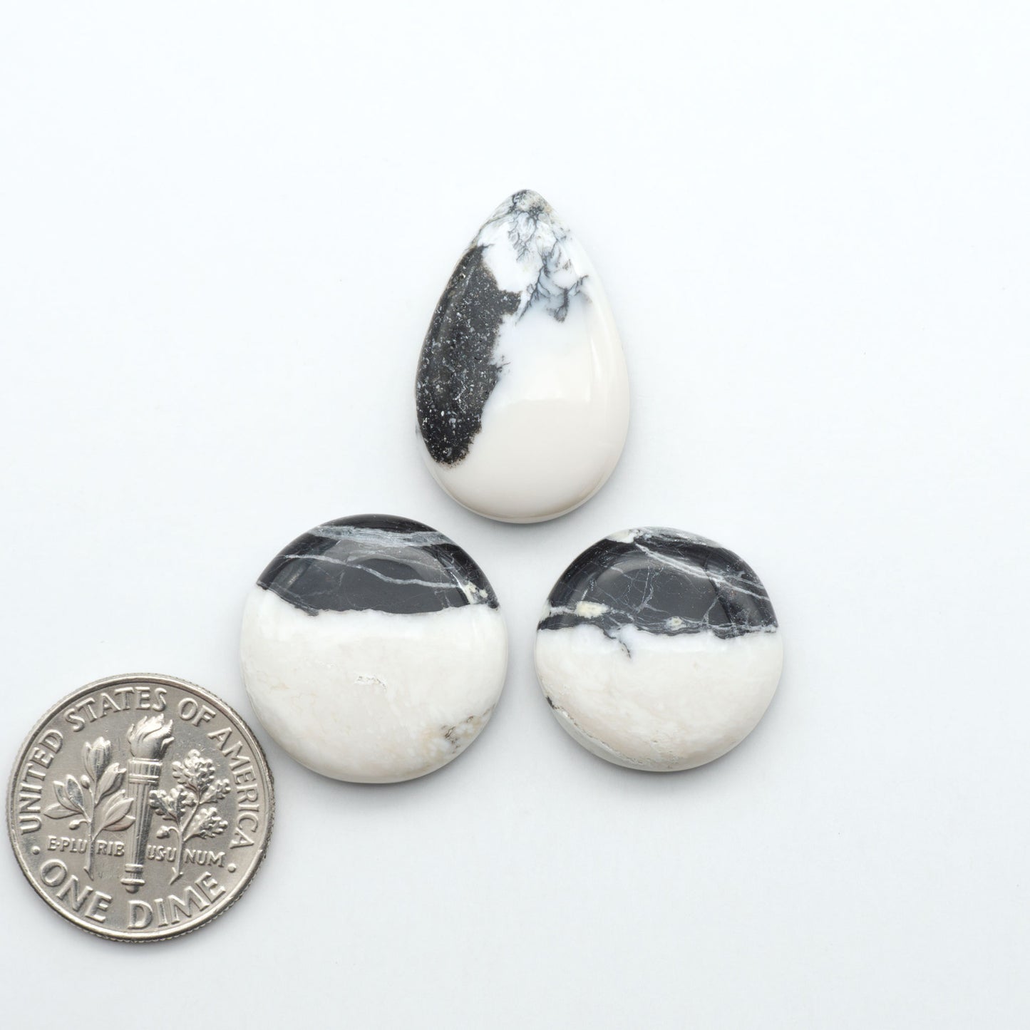 Natural White Buffalo Stone Cabochons are semi-precious gemstones cut into shapes ideal for jewelry-making, making them an excellent choice for artisans.