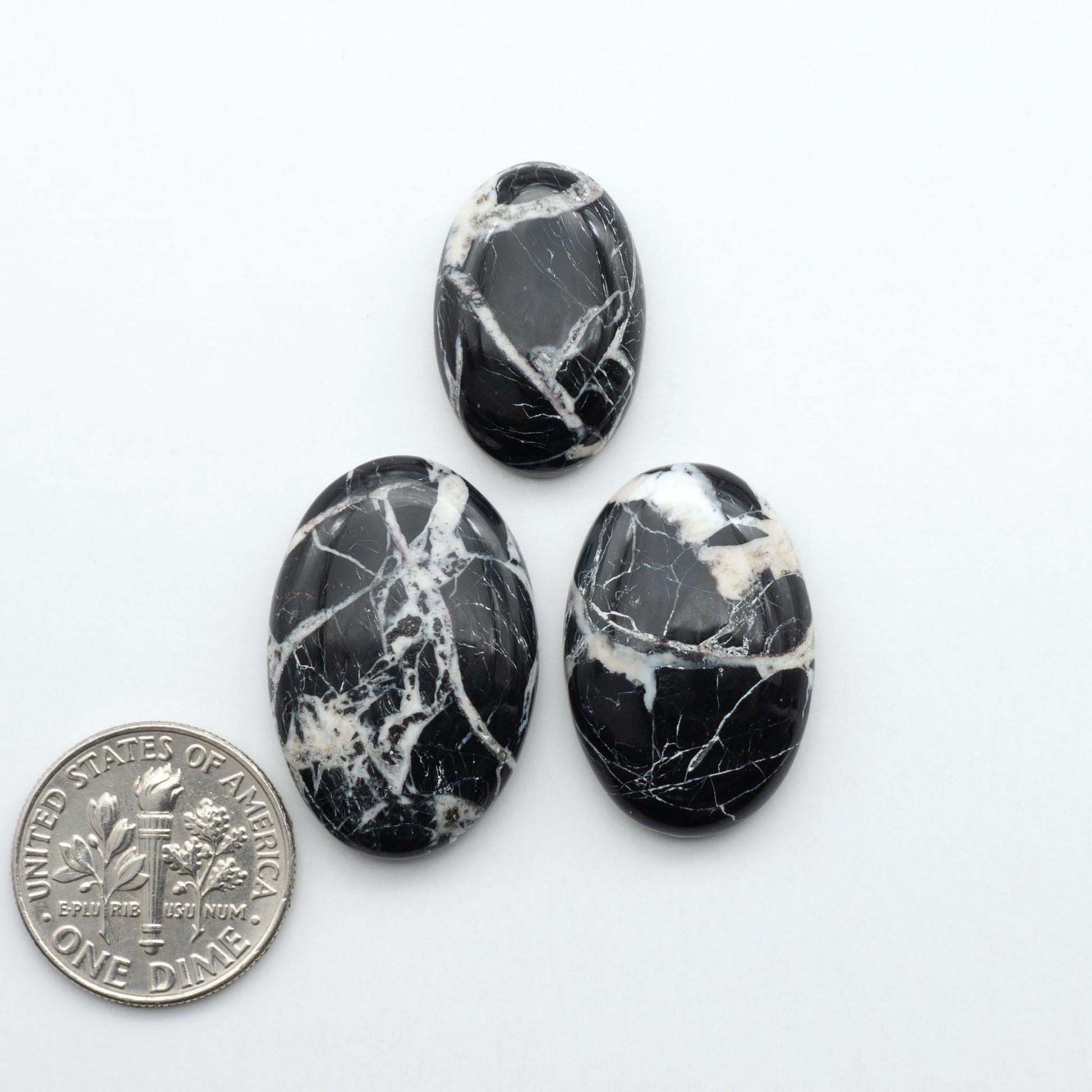 Natural White Buffalo Stone Cabochons are semi-precious gemstones cut into shapes ideal for jewelry-making, making them an excellent choice for artisans.