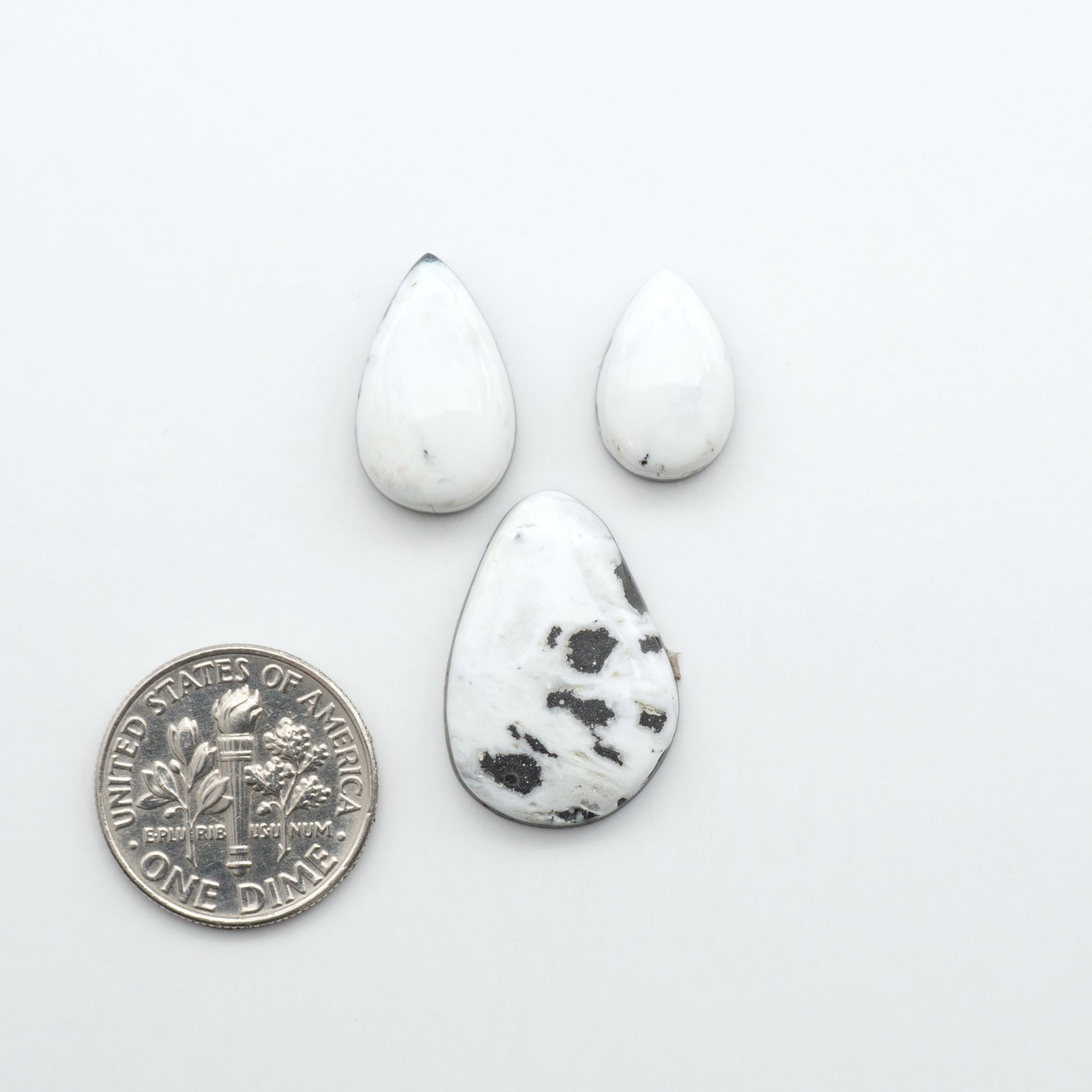 Natural White Buffalo Stone Cabochons are semi-precious gemstones cut into shapes ideal for jewelry-making, making them an excellent choice for artisans.
