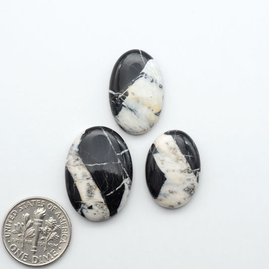 Natural White Buffalo Stone Cabochons are semi-precious gemstones cut into shapes ideal for jewelry-making, making them an excellent choice for artisans.