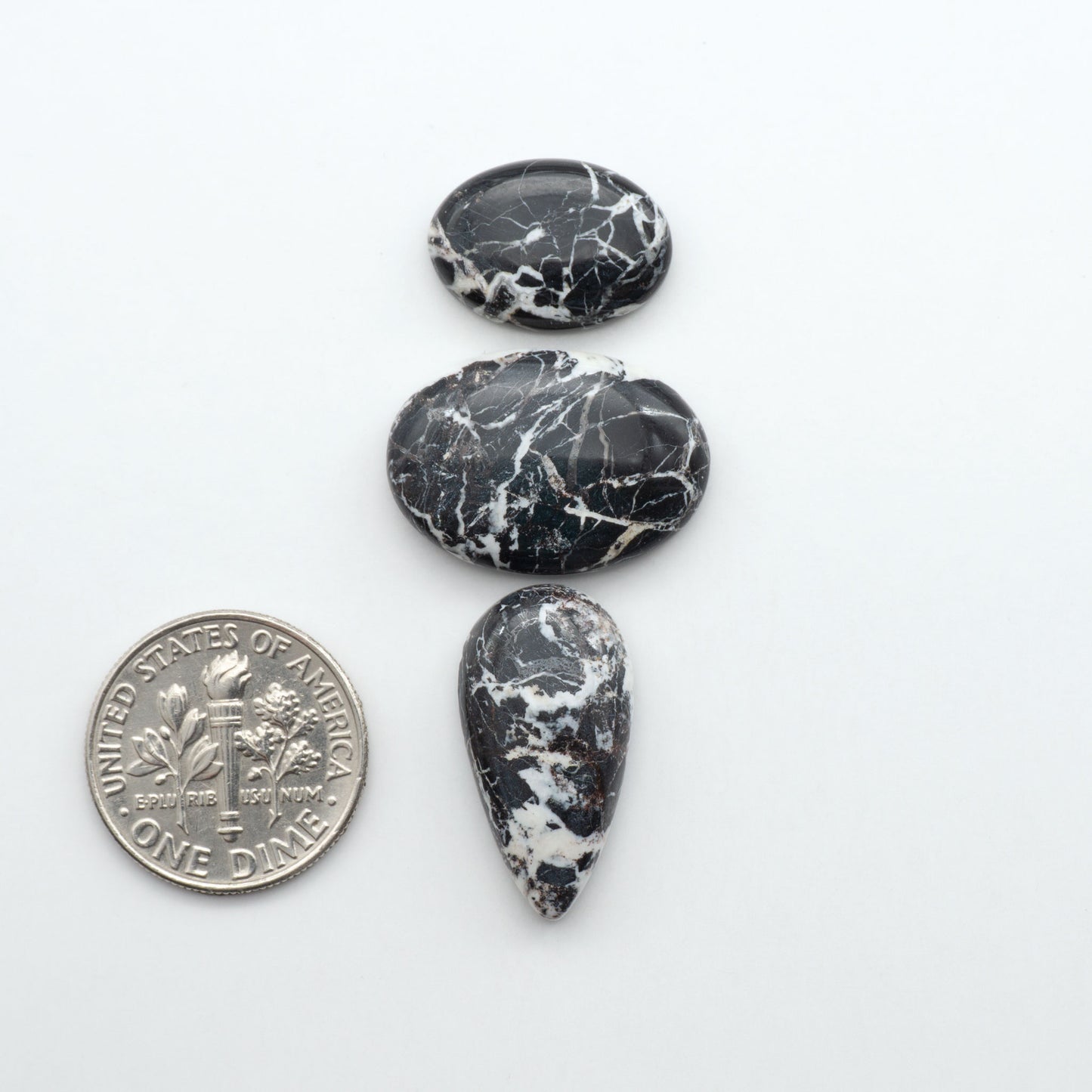 Natural White Buffalo Stone Cabochons are semi-precious gemstones cut into shapes ideal for jewelry-making, making them an excellent choice for artisans.