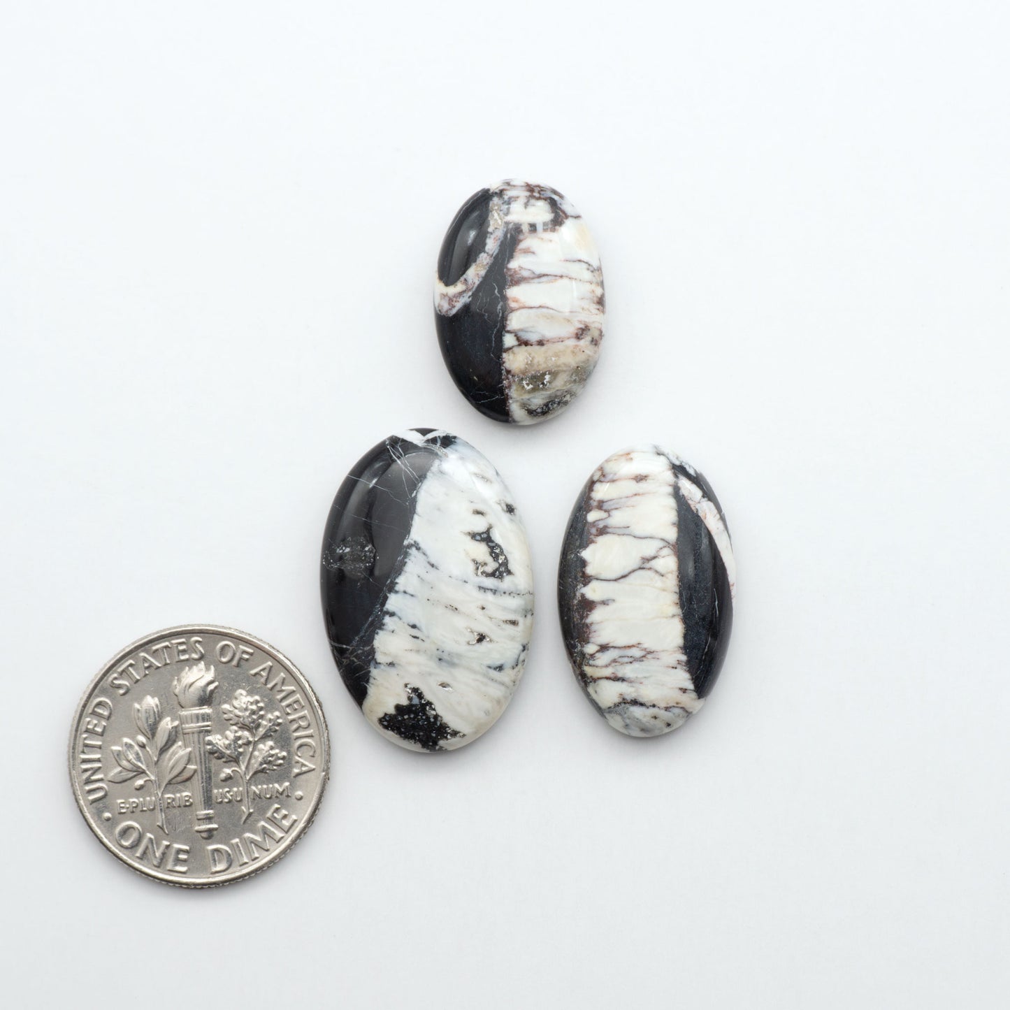 Natural White Buffalo Stone Cabochons are semi-precious gemstones cut into shapes ideal for jewelry-making, making them an excellent choice for artisans.