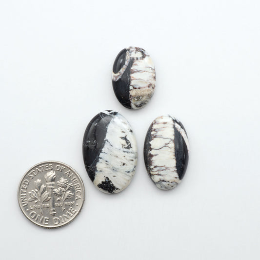 Natural White Buffalo Stone Cabochons are semi-precious gemstones cut into shapes ideal for jewelry-making, making them an excellent choice for artisans.