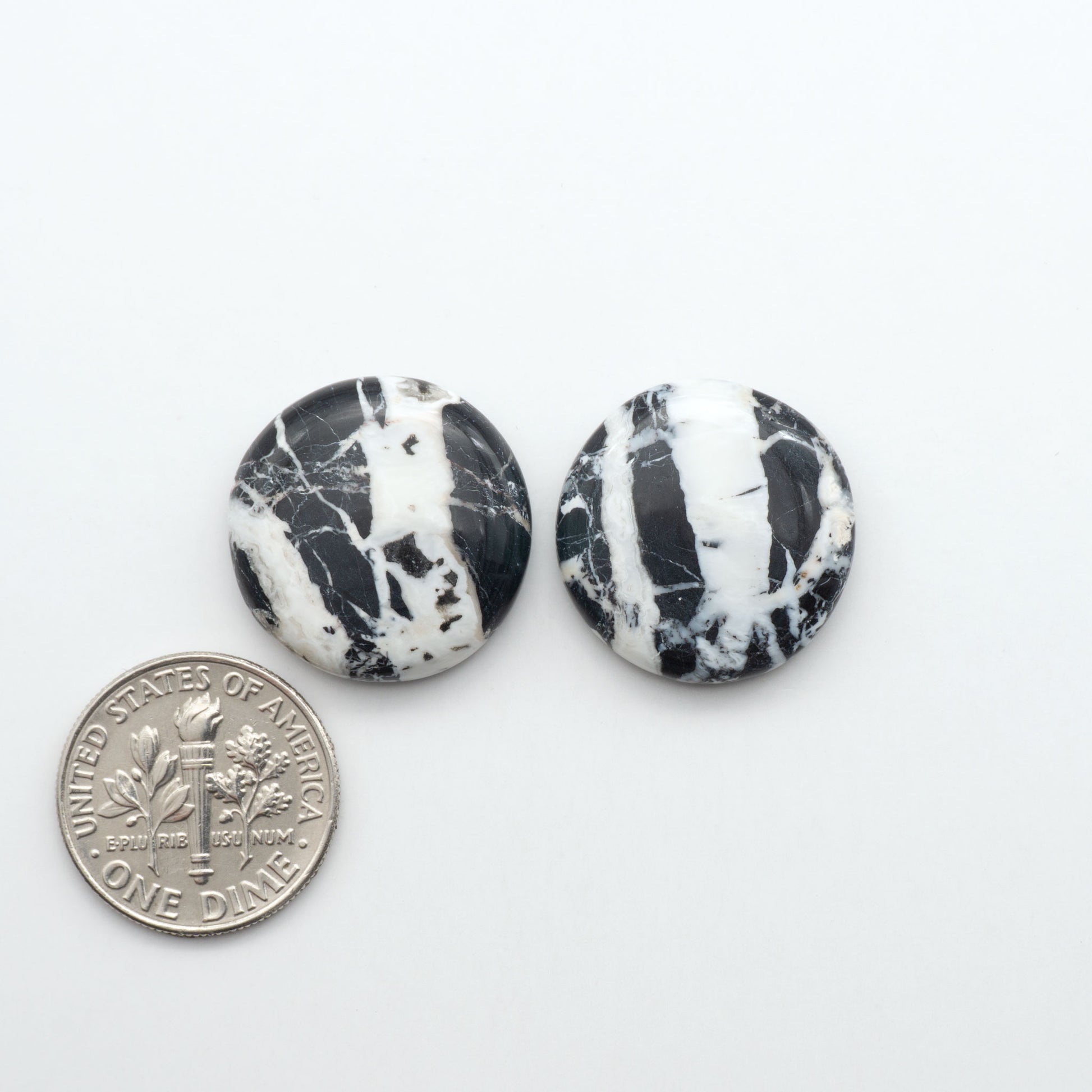 Natural White Buffalo Stone Cabochons are semi-precious gemstones cut into shapes ideal for jewelry-making, making them an excellent choice for artisans.