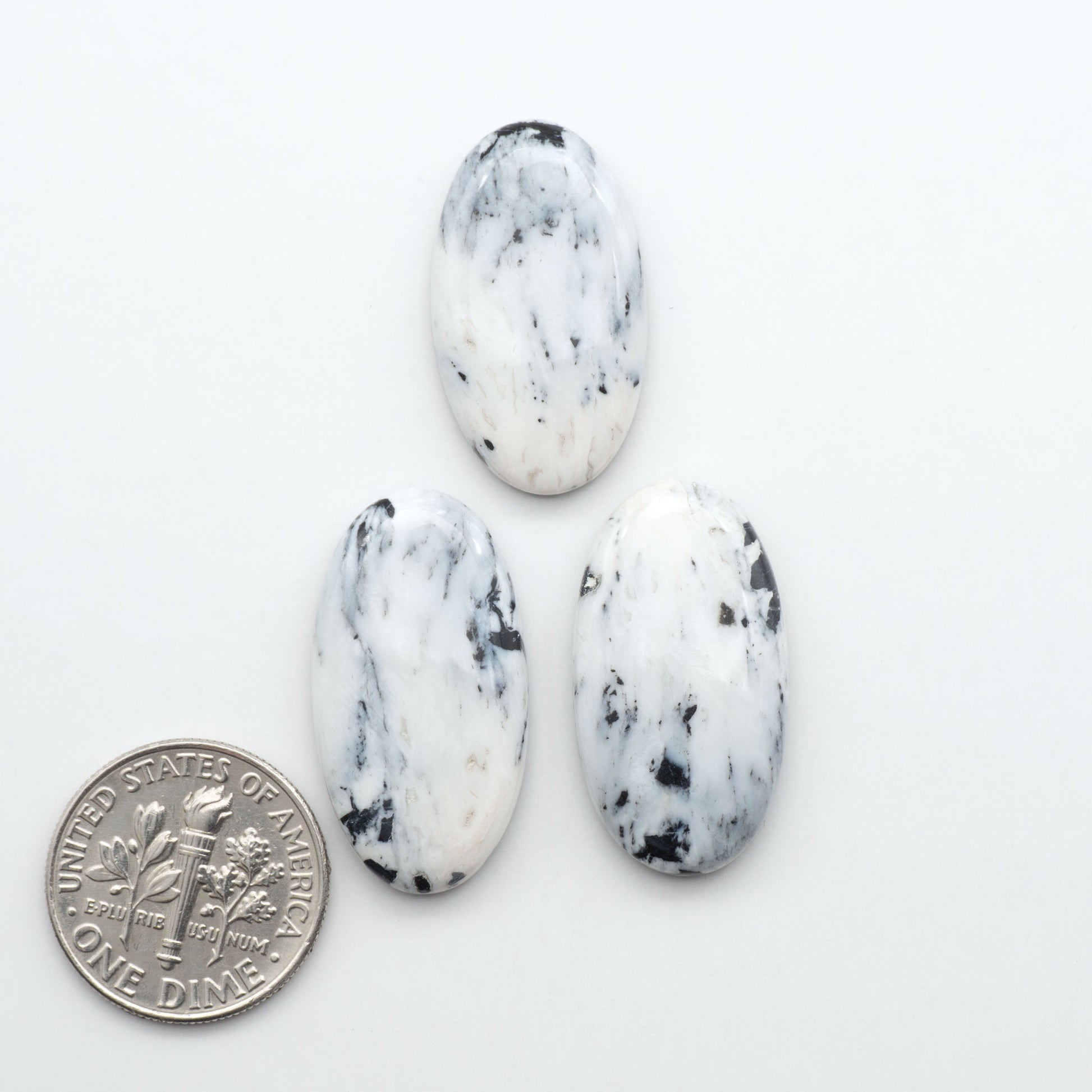 Natural White Buffalo Stone Cabochons are semi-precious gemstones cut into shapes ideal for jewelry-making, making them an excellent choice for artisans.
