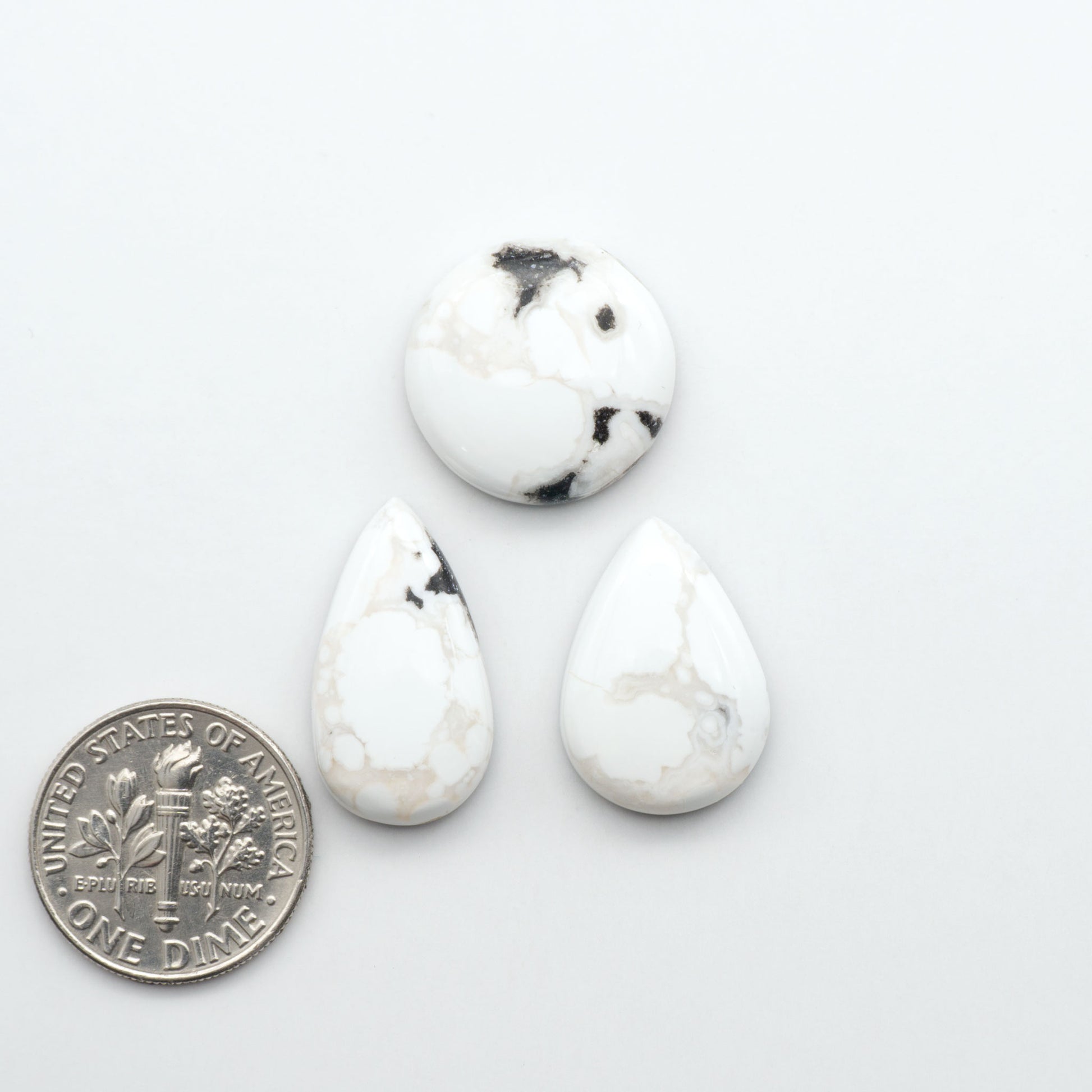 Natural White Buffalo Stone Cabochons are semi-precious gemstones cut into shapes ideal for jewelry-making, making them an excellent choice for artisans.