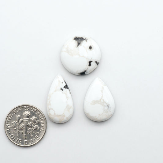 Natural White Buffalo Stone Cabochons are semi-precious gemstones cut into shapes ideal for jewelry-making, making them an excellent choice for artisans.