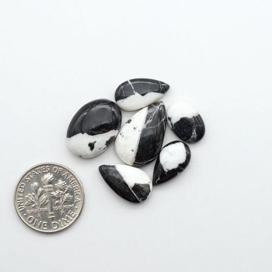 Natural White Buffalo Stone Cabochons are semi-precious gemstones cut into shapes ideal for jewelry-making, making them an excellent choice for artisans.