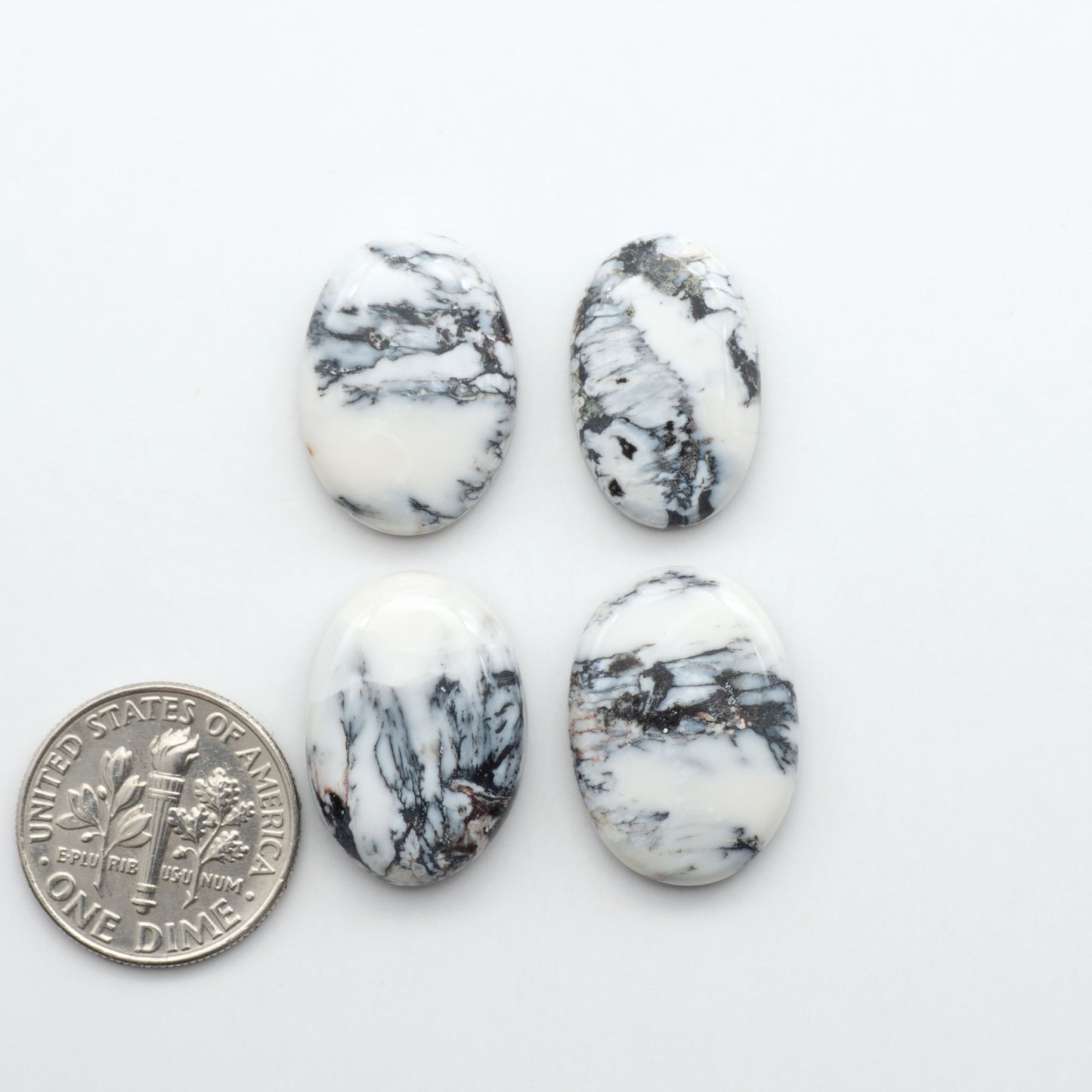 Natural White Buffalo Stone Cabochons are semi-precious gemstones cut into shapes ideal for jewelry-making, making them an excellent choice for artisans.