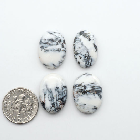 Natural White Buffalo Stone Cabochons are semi-precious gemstones cut into shapes ideal for jewelry-making, making them an excellent choice for artisans.