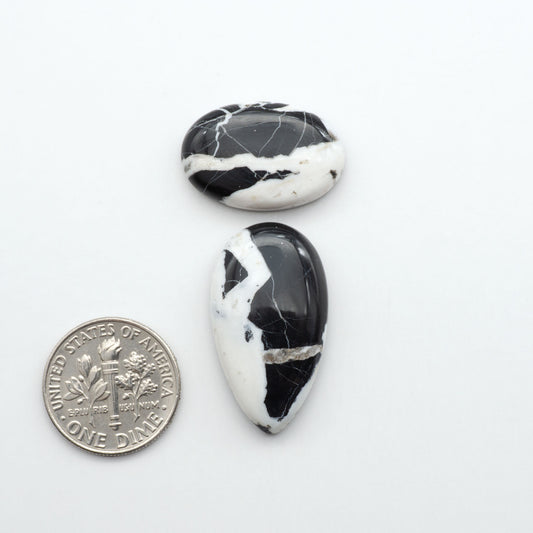 Natural White Buffalo Stone Cabochons are semi-precious gemstones cut into shapes ideal for jewelry-making, making them an excellent choice for artisans.