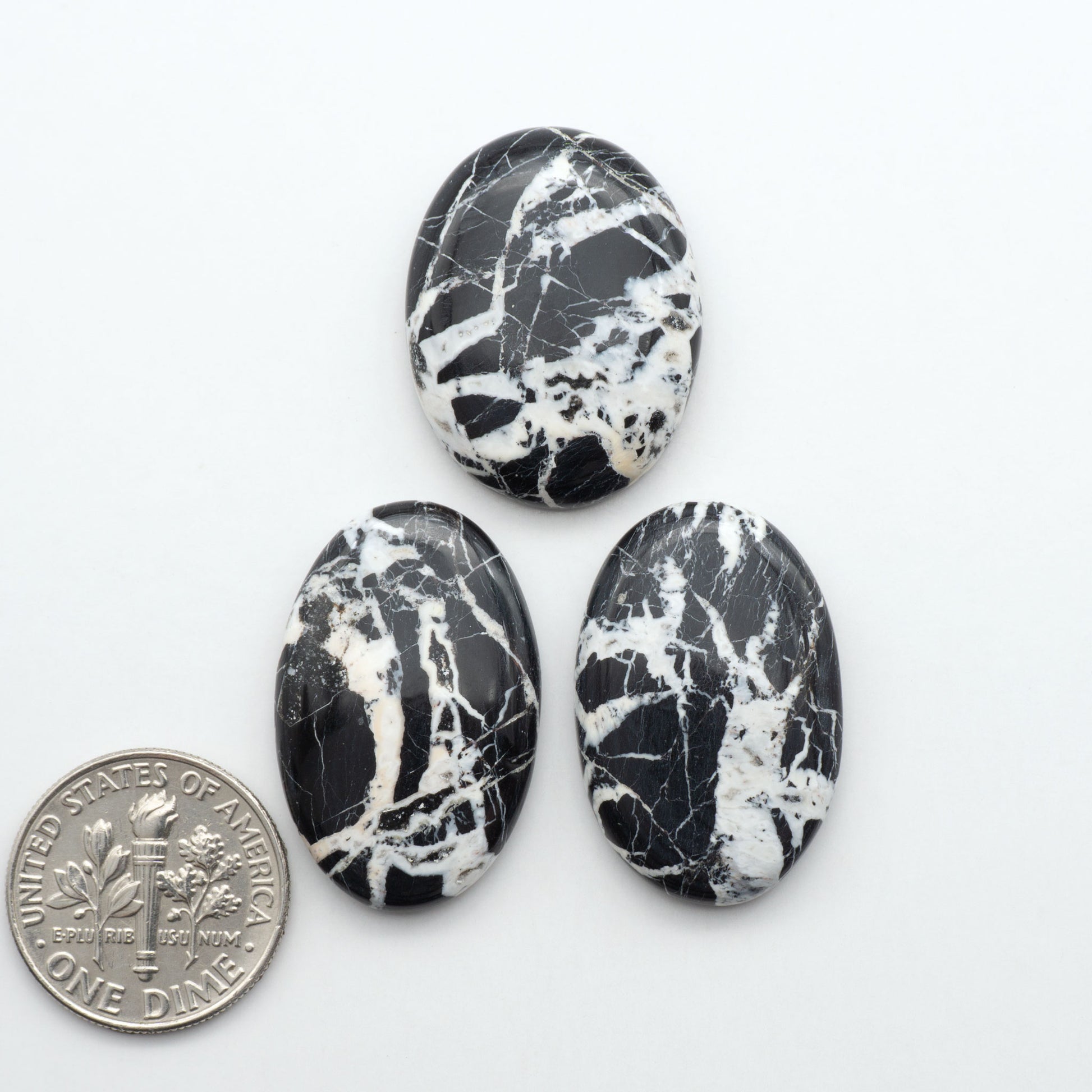 Natural White Buffalo Stone Cabochons are semi-precious gemstones cut into shapes ideal for jewelry-making, making them an excellent choice for artisans.