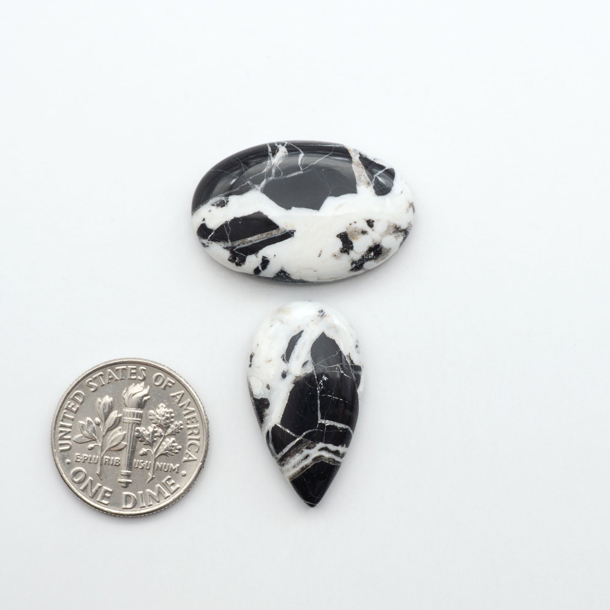 Natural White Buffalo Stone Cabochons are semi-precious gemstones cut into shapes ideal for jewelry-making, making them an excellent choice for artisans.