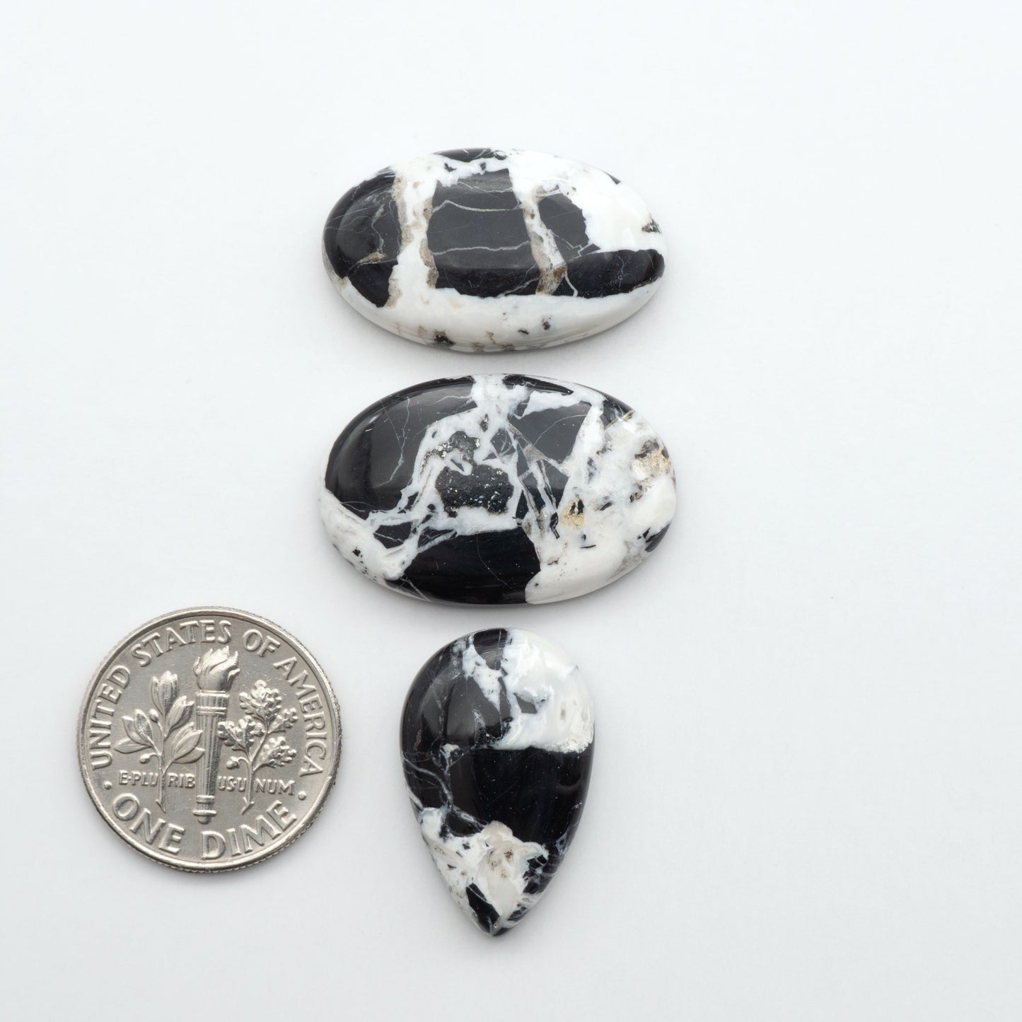 Natural White Buffalo Stone Cabochons are semi-precious gemstones cut into shapes ideal for jewelry-making, making them an excellent choice for artisans.