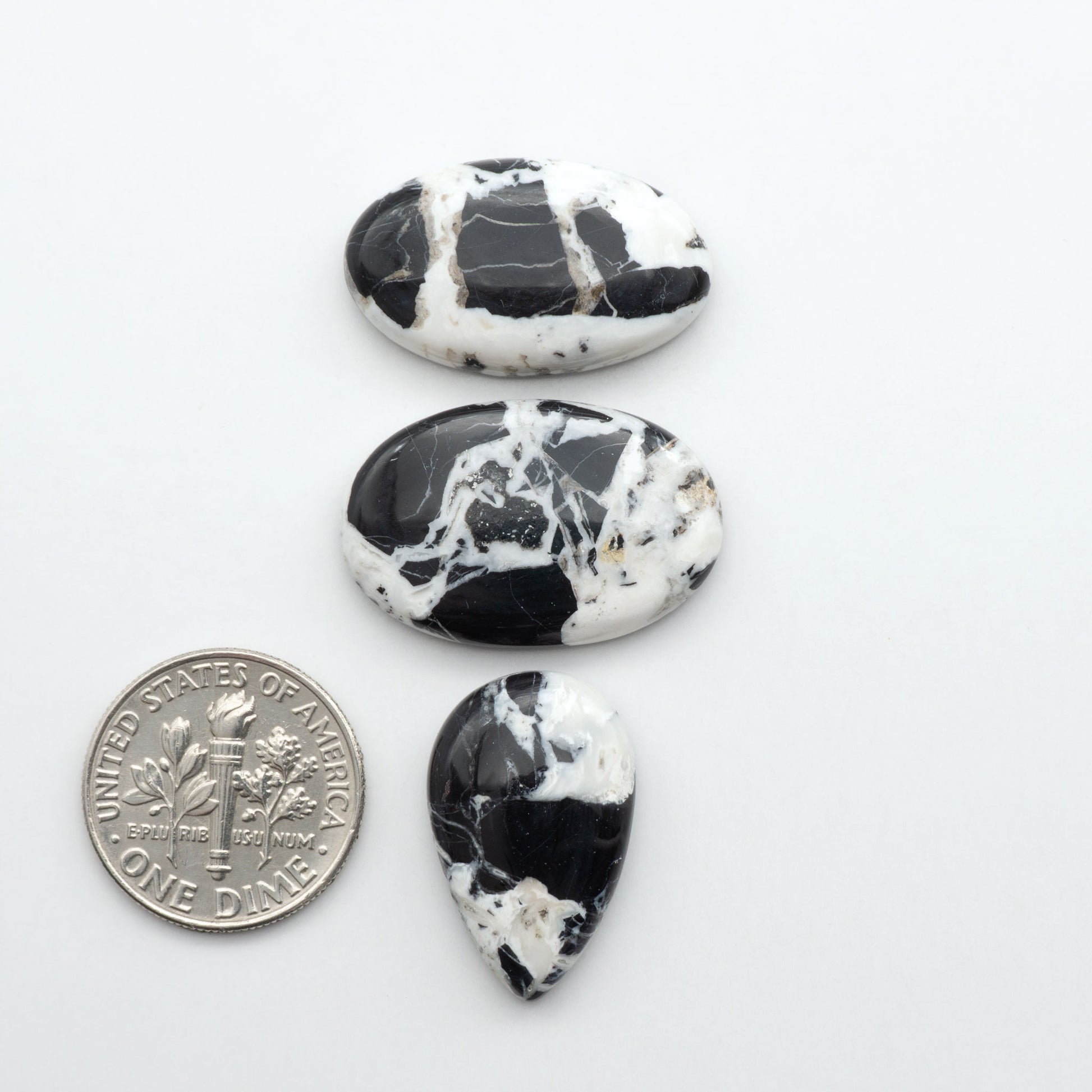 Natural White Buffalo Stone Cabochons are semi-precious gemstones cut into shapes ideal for jewelry-making, making them an excellent choice for artisans.