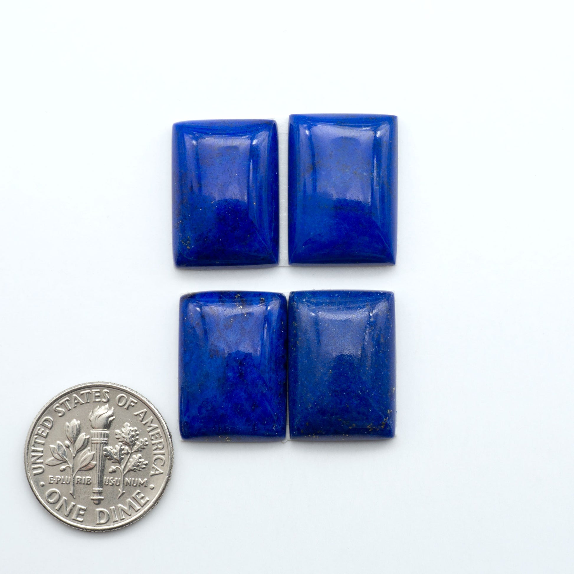 Shop natural Lapis Lazuli cabochons with rich blue tones and golden pyrite, perfect for silversmiths and jewelry makers designing custom pieces.