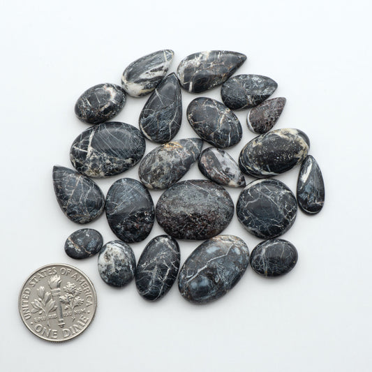 Natural White Buffalo Stone Cabochons are semi-precious gemstones cut into shapes ideal for jewelry-making, making them an excellent choice for artisans.