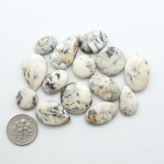 Natural White Buffalo Stone Cabochons are semi-precious gemstones cut into shapes ideal for jewelry-making, making them an excellent choice for artisans.