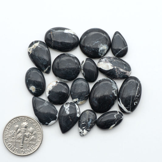 Natural White Buffalo Stone Cabochons are semi-precious gemstones cut into shapes ideal for jewelry-making, making them an excellent choice for artisans.