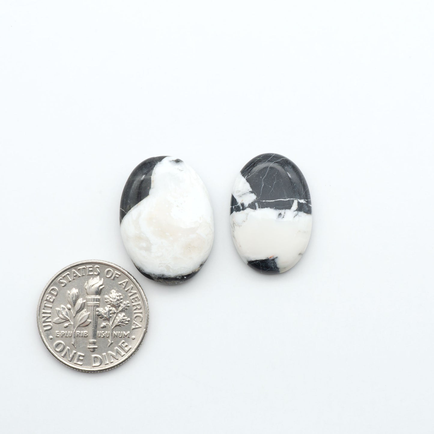 Natural White Buffalo Stone Cabochons are semi-precious gemstones cut into shapes ideal for jewelry-making, making them an excellent choice for artisans.