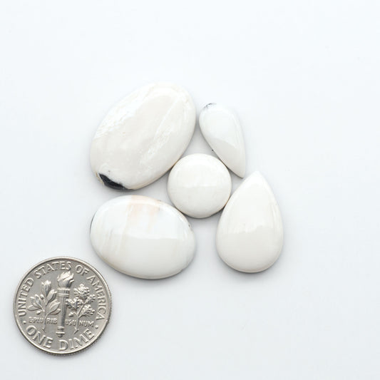 Natural White Buffalo Stone Cabochons are semi-precious gemstones cut into shapes ideal for jewelry-making, making them an excellent choice for artisans.