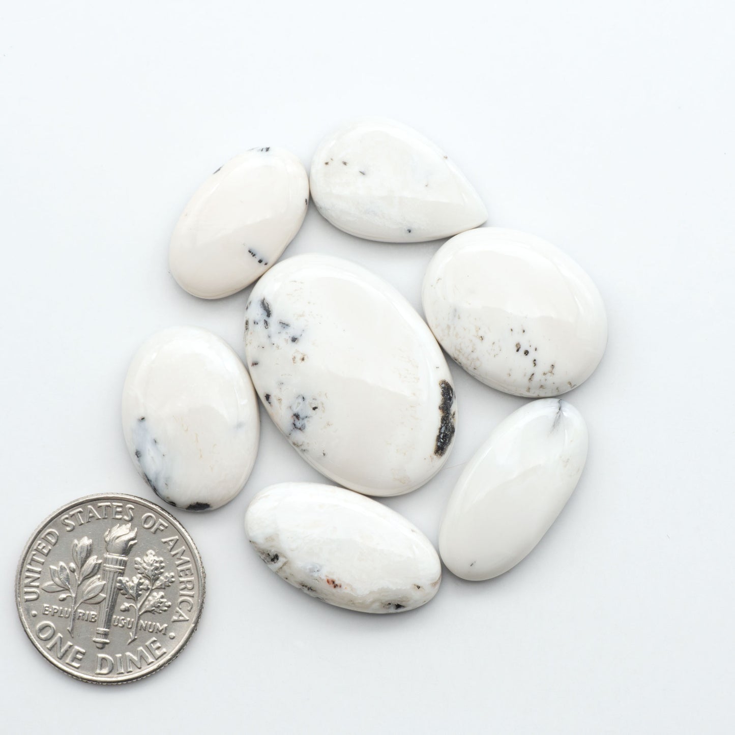 Natural White Buffalo Stone Cabochons are semi-precious gemstones cut into shapes ideal for jewelry-making, making them an excellent choice for artisans.