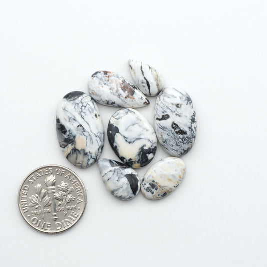 Natural White Buffalo Stone Cabochons are semi-precious gemstones cut into shapes ideal for jewelry-making, making them an excellent choice for artisans.
