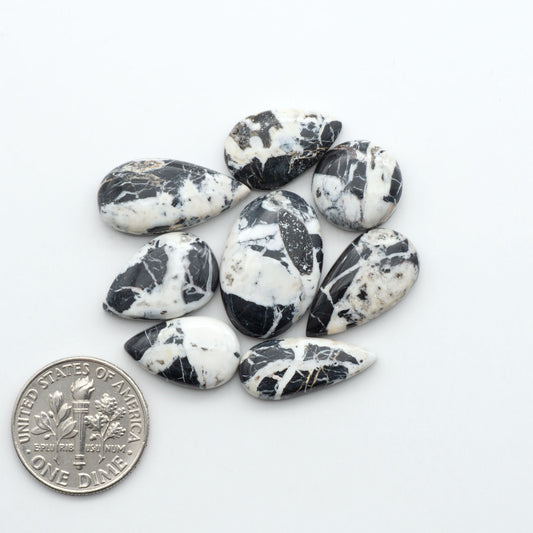 Natural White Buffalo Stone Cabochons are semi-precious gemstones cut into shapes ideal for jewelry-making, making them an excellent choice for artisans.