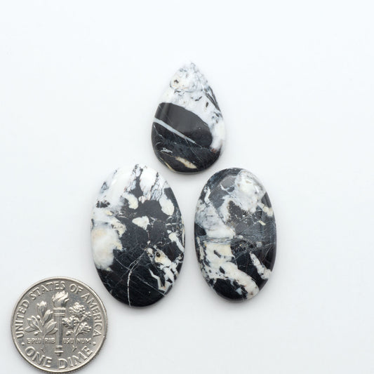 Natural White Buffalo Stone Cabochons are semi-precious gemstones cut into shapes ideal for jewelry-making, making them an excellent choice for artisans.