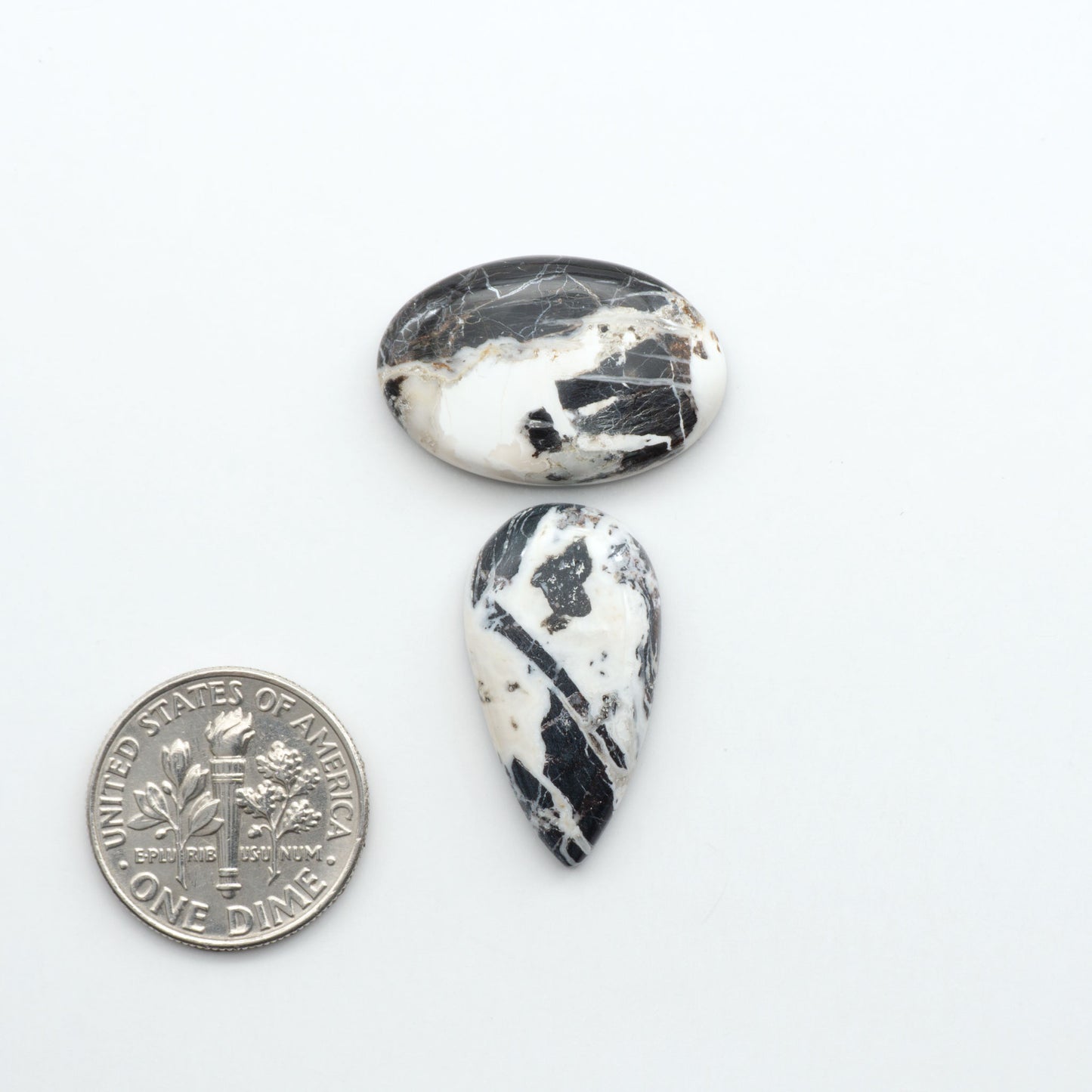 Natural White Buffalo Stone Cabochons are semi-precious gemstones cut into shapes ideal for jewelry-making, making them an excellent choice for artisans.