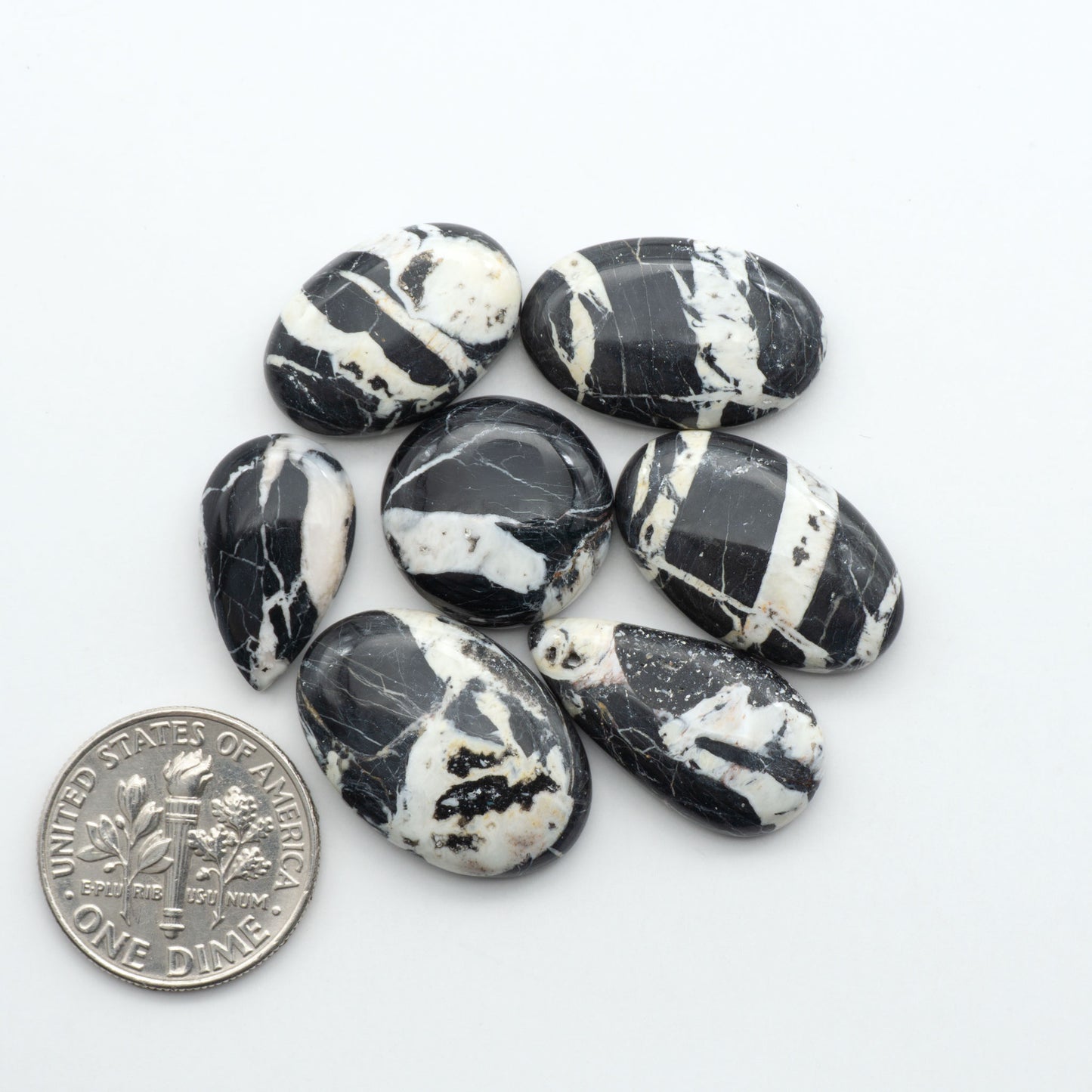 Natural White Buffalo Stone Cabochons are semi-precious gemstones cut into shapes ideal for jewelry-making, making them an excellent choice for artisans.