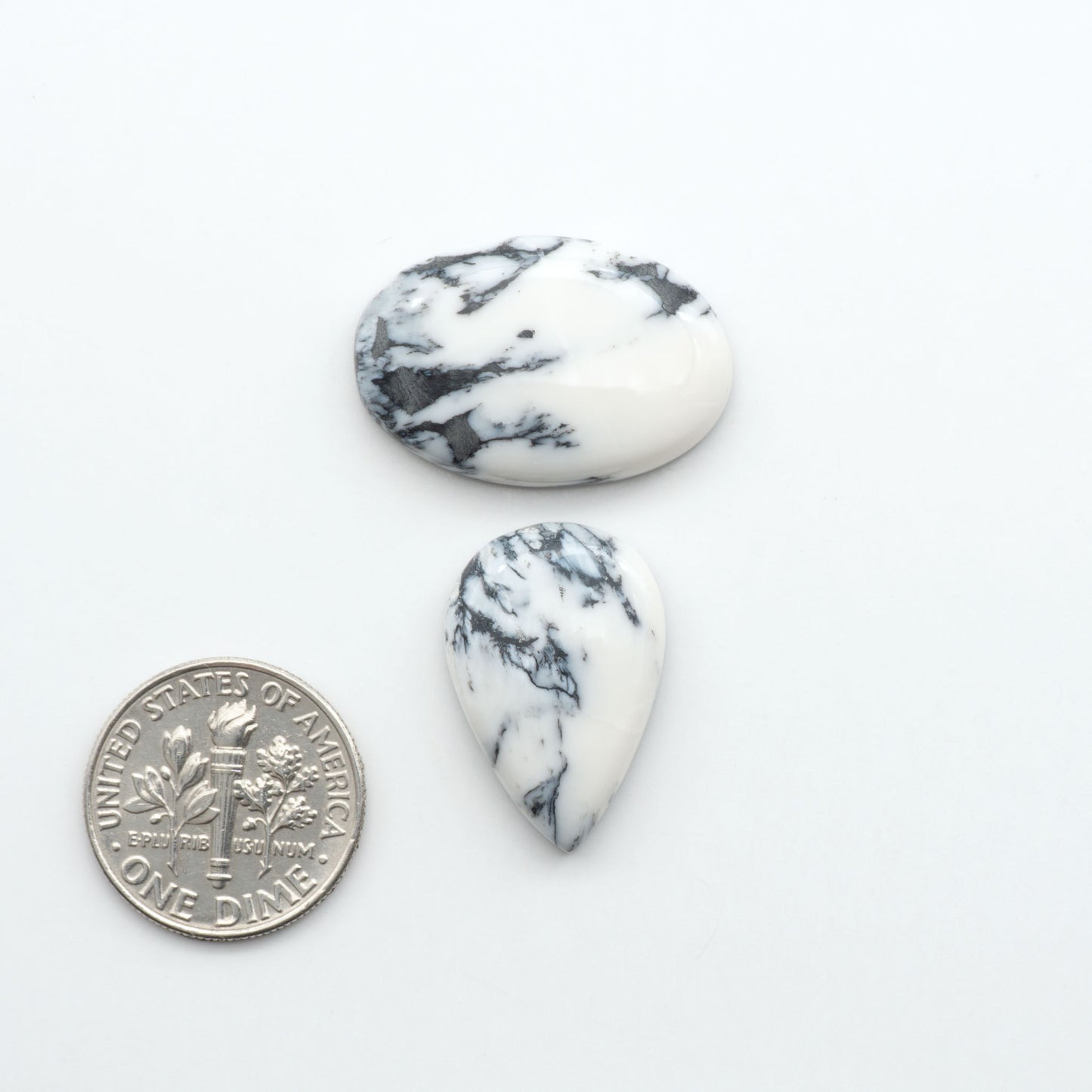 Natural White Buffalo Stone Cabochons are semi-precious gemstones cut into shapes ideal for jewelry-making, making them an excellent choice for artisans.