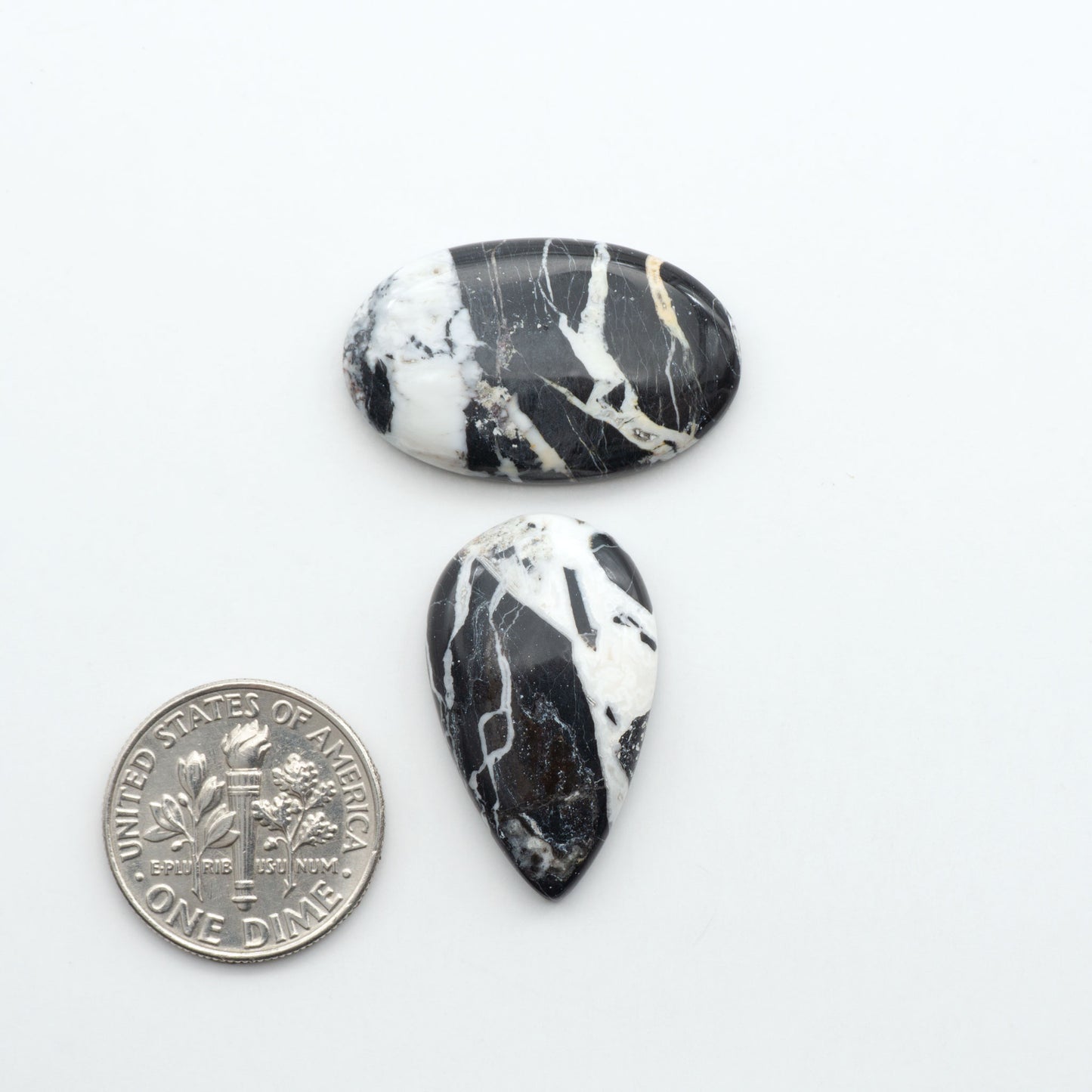 Natural White Buffalo Stone Cabochons are semi-precious gemstones cut into shapes ideal for jewelry-making, making them an excellent choice for artisans.