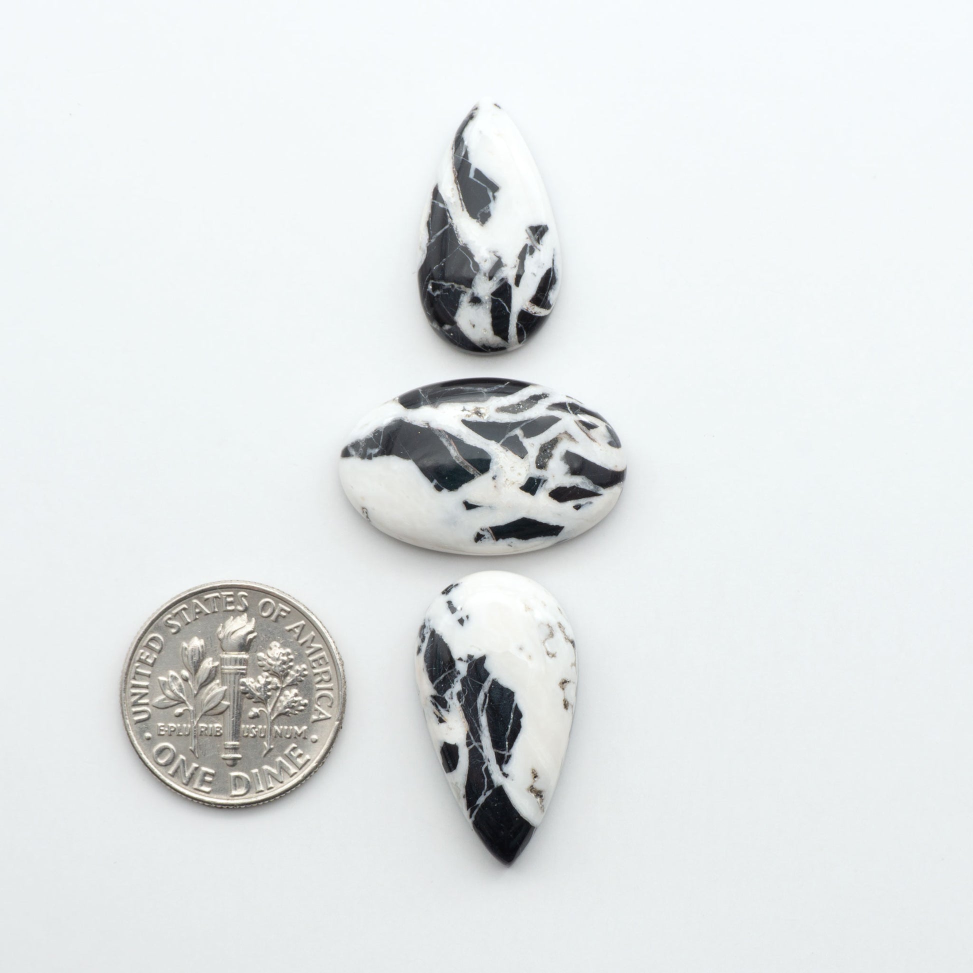 Natural White Buffalo Stone Cabochons are semi-precious gemstones cut into shapes ideal for jewelry-making, making them an excellent choice for artisans.