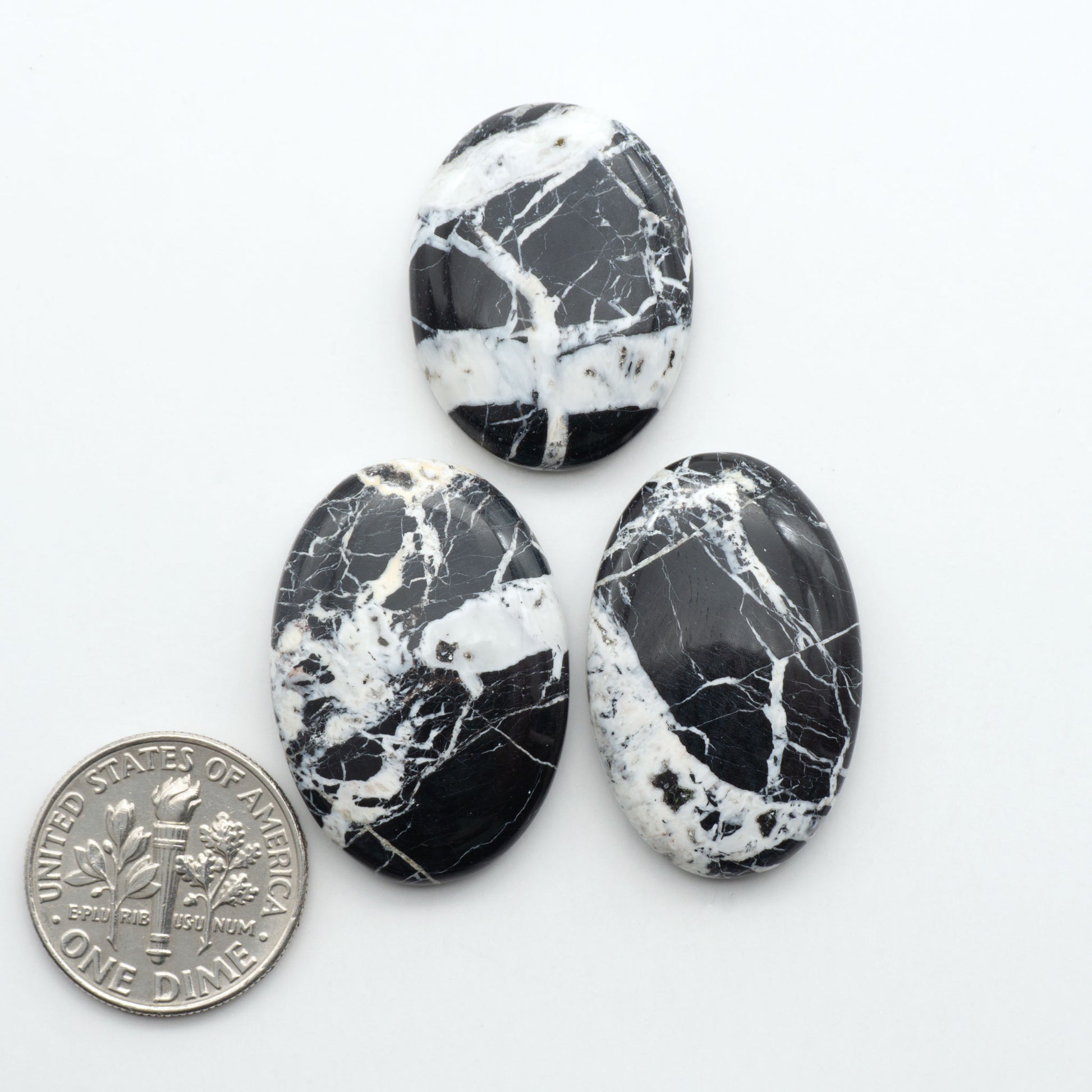 Natural White Buffalo Stone Cabochons are semi-precious gemstones cut into shapes ideal for jewelry-making, making them an excellent choice for artisans.