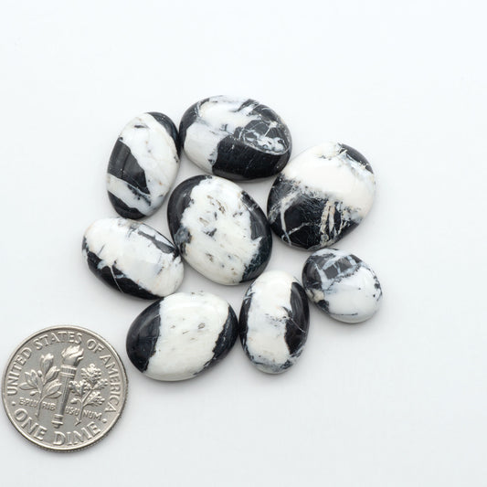 Natural White Buffalo Stone Cabochons are semi-precious gemstones cut into shapes ideal for jewelry-making, making them an excellent choice for artisans.