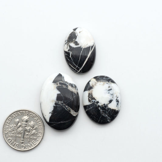 Natural White Buffalo Stone Cabochons are semi-precious gemstones cut into shapes ideal for jewelry-making, making them an excellent choice for artisans.