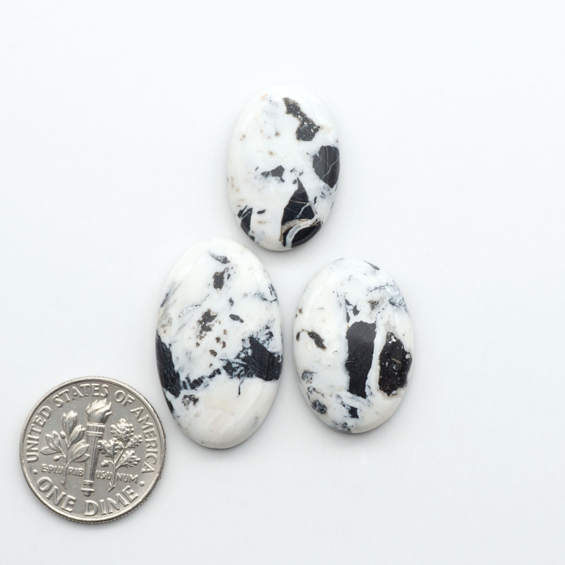 Natural White Buffalo Stone Cabochons are semi-precious gemstones cut into shapes ideal for jewelry-making, making them an excellent choice for artisans.