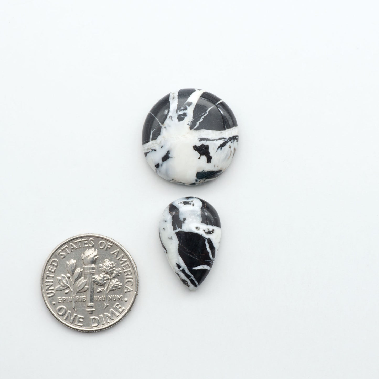 Natural White Buffalo Stone Cabochons are semi-precious gemstones cut into shapes ideal for jewelry-making, making them an excellent choice for artisans.