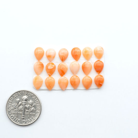 Discover natural pink Coral cabochons with soft salmon hues and smooth polish, ideal for creating timeless handcrafted rings, pendants, and custom designs.