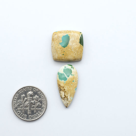 Royston Turquoise cabochons are famous for their distinctive matrix and unique green and blue hues, making them a favored option among jewelry designers.