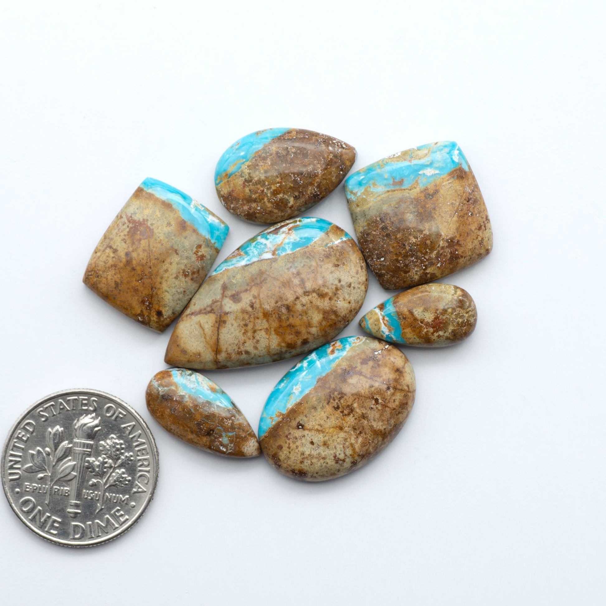 Royston Turquoise cabochons are famous for their distinctive matrix and unique green and blue hues, making them a favored option among jewelry designers.