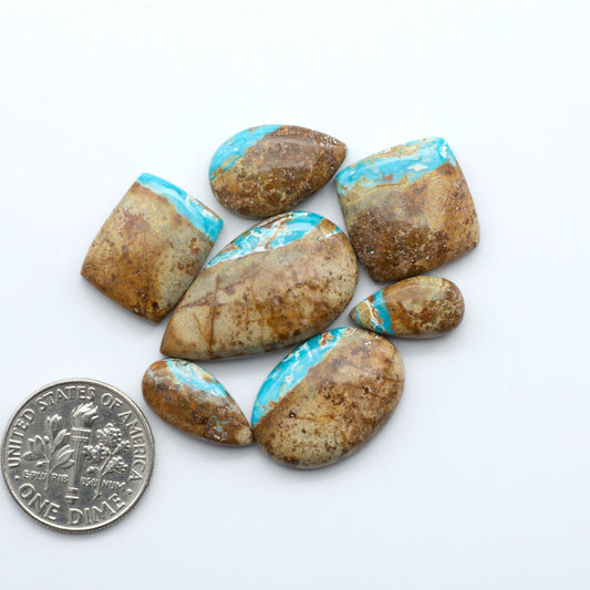 Royston Turquoise cabochons are famous for their distinctive matrix and unique green and blue hues, making them a favored option among jewelry designers.
