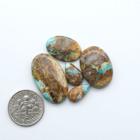 Royston Turquoise cabochons are famous for their distinctive matrix and unique green and blue hues, making them a favored option among jewelry designers.